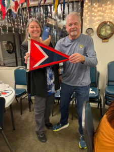 Mia's cousin Henry Wahlstedt (On cell phone in Sweden) and 2022 Commodore Jerry McNulty 11.3.22